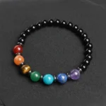 7-chakras-onyx-ardoise Bracelet 7 chakras onyx sur ardoise sombre