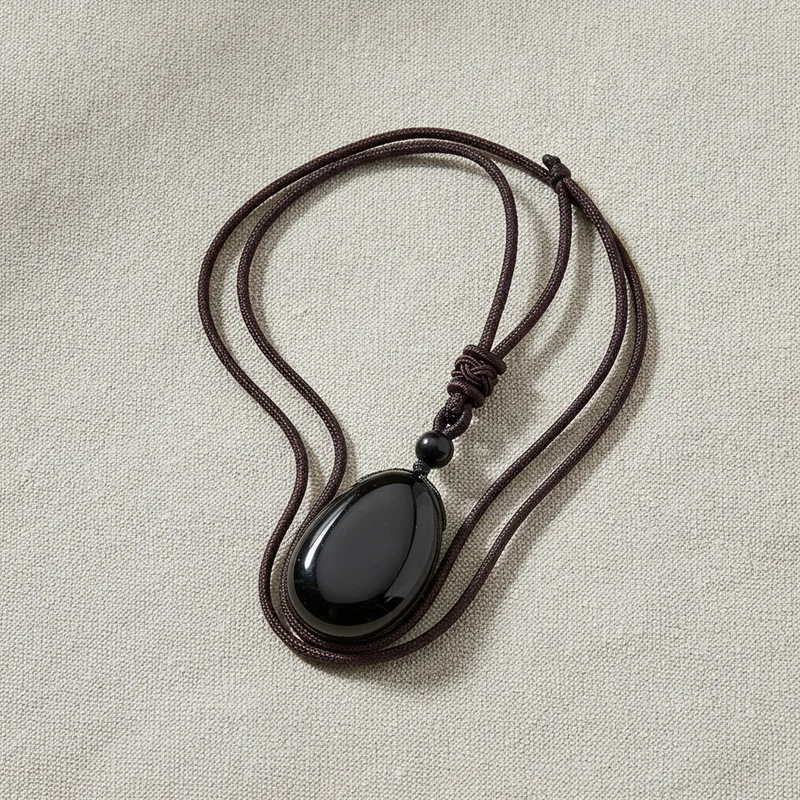 Pendentif obsidienne noire sur lin clair